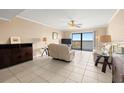 Inviting living room with tile floor, ceiling fan, comfortable seating and water views at 7300 Sun Island S Dr # 605, South Pasadena, FL 33707