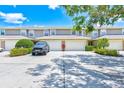 Attractive townhome exteriors with garages and meticulous landscaping, showcasing curb appeal at 8253 118Th Ave, Largo, FL 33773