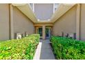 Inviting front entrance framed by manicured hedges creating a warm welcome at 8253 118Th Ave, Largo, FL 33773