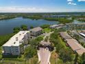 Aerial view of a well-maintained condo community with a lake view at 10038 62Nd N Ter # 17, St Petersburg, FL 33708