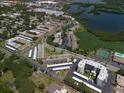 Aerial view of a well-maintained condo community near a pond at 10038 62Nd N Ter # 17, St Petersburg, FL 33708