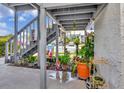 Cozy entrance area featuring a staircase, lush plants, and decorative accents for added charm at 11201 122Nd Ave # 167, Largo, FL 33778