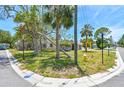 Charming single-story house situated on a corner lot with lush trees and a vintage fire hydrant at 123 14Th Ave, Indian Rocks Beach, FL 33785