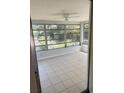 Bright, airy Florida room with a ceiling fan, perfect for relaxing or entertaining at 2271 Terrace N Dr, Clearwater, FL 33765