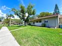 Beautiful single story home with well-maintained lawn and attractive landscaping at 30 Tads Trl, Oldsmar, FL 34677