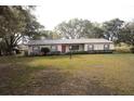 Single story brick house with shutters and a well kept lawn at 3705 Bruton, Plant City, FL 33565