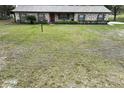 Well-manicured lawn and landscaped garden beds at 3705 Bruton, Plant City, FL 33565