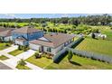 Expansive view of a well-maintained home featuring a landscaped yard and a fenced backyard at 3935 Capri Coast Dr, Plant City, FL 33565