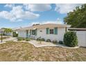 Attractive single-story home with a landscaped front yard and a cozy front porch area at 708 Rutgers Pl, Sun City Center, FL 33573