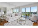 Cozy living room with comfortable seating, perfect for relaxing and enjoying the view at 9000 Commodore Dr # 606, Seminole, FL 33776