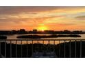 Sunset view from the balcony of the condo complex, perfect for a relaxing evening at 9000 Commodore Dr # 606, Seminole, FL 33776