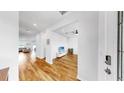 Bright living room with hardwood floors and a ceiling fan at 9293 Rally Spring Loop, Wesley Chapel, FL 33545