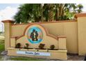 Inviting Paradise Lakes community sign featuring a decorative monument and manicured landscaping at 21103 Patio View Ct # 3302, Lutz, FL 33558