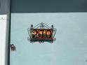 Close-up of the decorative house number '270' on the exterior wall at 250 Rosery Nw Rd # 270, Largo, FL 33770