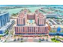 Beautiful aerial view of beachfront condo showing pool and stunning city views at 301 S Gulfview Blvd # 301, Clearwater Beach, FL 33767