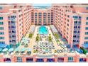 Gorgeous rooftop pool area with lounge chairs and ocean view at 301 S Gulfview Blvd # 301, Clearwater Beach, FL 33767