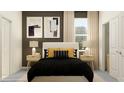 Inviting bedroom with plush bedding, soft lighting, and contemporary artwork at 31856 Griffin Sands Ln, San Antonio, FL 33576