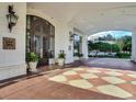 Elegant entrance with tiled floors, grand doors, and lush landscaping at 345 Bayshore Blvd # 1813, Tampa, FL 33606
