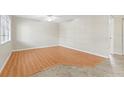 Bright living room with hardwood floors, ceiling fan and large windows at 6100 Gulfport S Blvd # 114, Gulfport, FL 33707