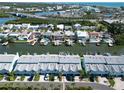 A beautiful aerial view of waterfront townhomes with boat docks and easy access to the bay and beaches at 659 Garland Cir, Indian Rocks Beach, FL 33785