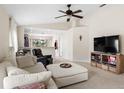 Bright living room featuring tile floors, ceiling fan, and an open floor plan at 816 College Chase Dr, Ruskin, FL 33570