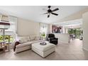 Inviting living room boasting tile floors and an open layout to the kitchen at 816 College Chase Dr, Ruskin, FL 33570
