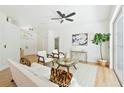 Inviting living room featuring neutral decor, light-colored flooring, and an abundance of natural light at 970 Ridgewood Ter, Tarpon Springs, FL 34689