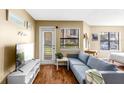 Bright living room with a comfortable blue sofa and a mounted television for relaxing entertainment at 11901 4Th N St # 5111, St Petersburg, FL 33716