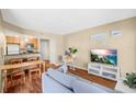 Bright living room with wood floors, neutral paint, and an open layout to the kitchen at 11901 4Th N St # 5111, St Petersburg, FL 33716