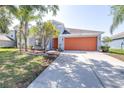 Attractive single-Gathering home with a long driveway and a two-car garage in a Gathering-friendly neighborhood at 12136 Luftburrow Ln, Hudson, FL 34669