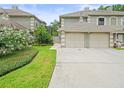 Charming two-story home with well-maintained landscaping and a two-car garage at 14134 Trouville Dr, Tampa, FL 33624