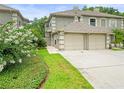 Charming two-story home with well-maintained landscaping and a two-car garage at 14134 Trouville Dr, Tampa, FL 33624