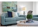 Cozy living room featuring stylish sofas, a decorative coffee table, and artistic details throughout at 17920 Gulf Blvd # 1806, Redington Shores, FL 33708