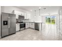 Modern kitchen featuring stainless steel appliances and ample counter space at 31355 Amberview Bnd, Wesley Chapel, FL 33545