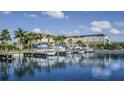 Community boat dock with multiple boat slips and clear water views on a sunny day at 3138 Nautical S Pl, St Petersburg, FL 33712