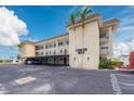 Exterior of the building with palm trees, parking, and well-maintained landscaping at 3789 46Th S Ave # 204, St Petersburg, FL 33711