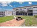 Spacious building exterior with manicured lawn, picnic table, and serene atmosphere for outdoor enjoyment at 3789 46Th S Ave # 204, St Petersburg, FL 33711
