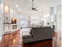 Spacious living room with fireplace, high ceilings, and view of the pool area at 382 Florian Way, Spring Hill, FL 34609