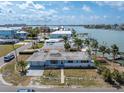 A waterfront home with an expansive backyard and private dock, perfect for enjoying the waterfront lifestyle at 399 161St Ave, Redington Beach, FL 33708