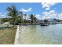 A serene waterfront with a private dock, providing direct access to the bay at 399 161St Ave, Redington Beach, FL 33708