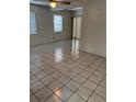 Bright living room featuring tile flooring, natural light and a ceiling fan at 5008 N Suwanee Ave, Tampa, FL 33603