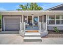 Cozy front porch with bench seating and a neutral color palette, perfect for relaxing outdoors at 504 7Th Sw Ave, Largo, FL 33770