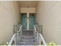 Close-up of double door entrance with metal railing leading to front door at 727 Coral Reef Dr, Tampa, FL 33602