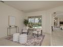 Comfortable living room with modern decor, plush seating, and a view of the pool area at 987 Chickadee Dr, Venice, FL 34285