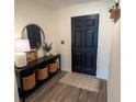 A beautifully decorated entryway with a black console table and accents at 10123 Carp Hollow Rd, Sun City Center, FL 33573