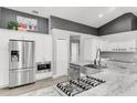 Modern kitchen with stainless steel appliances, granite countertops, and gas range at 11324 Cypress Reserve Dr, Tampa, FL 33626