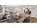 Comfortable living room showcases an open layout with a kitchen, dining area, and access to the outdoor patio at 1175 San Carlos Ne Ave, St Petersburg, FL 33702