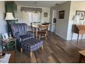 A lovely living room featuring hardwood floors and an ornate accent chair at 13000 90Th Ave, Seminole, FL 33776