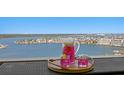 Charming balcony view featuring a refreshing drink setup with the coastline and ocean in the background at 17920 Gulf Blvd # 1901, Redington Shores, FL 33708