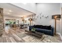 Open-concept living and dining areas with wood floors, high ceilings, and ample natural light at 2134 Serpentine S Cir, St Petersburg, FL 33712